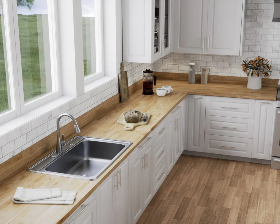 Kitchen with white cabinets, butcher block counters, subway tile backsplash, and window above sink